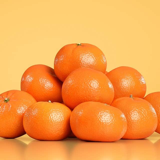 A pile of Mandarins on a golden background